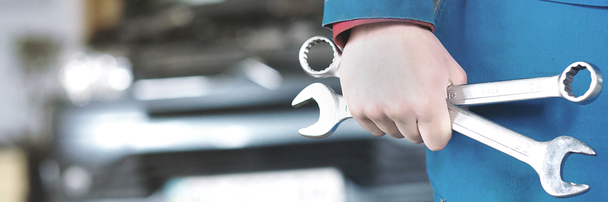 Mechanic holding tools ready to do a repair - Car Repairs Fenland